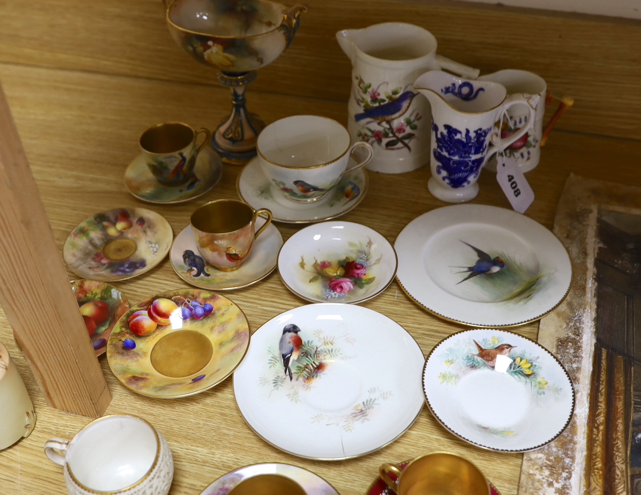 A large group of late 19th/early 20th century Royal Worcester tea wares, (some damage) including a signed bird painted pieces and signed fruit painted saucers